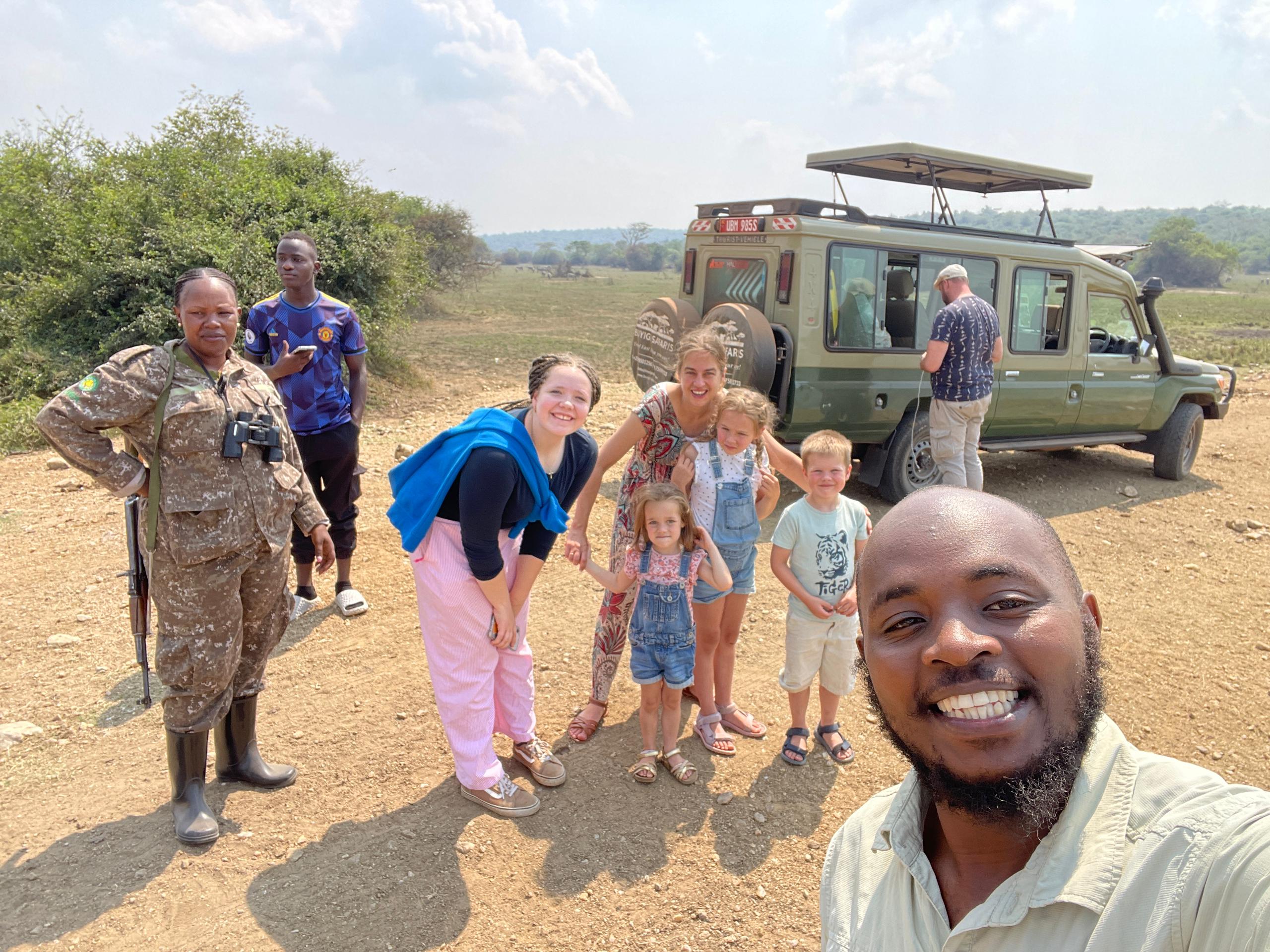 TRVE guide with guests and Land Cruiser on safari